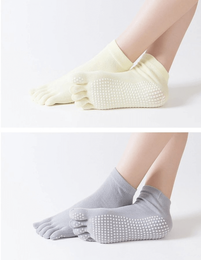 Two pairs of non-slip quick-drying five-toe socks in yellow and gray, perfect for yoga and fitness enthusiasts.